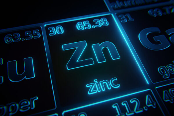 Focus on chemical element Zinc illuminated in periodic table of elements. 3D rendering